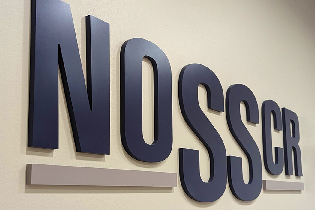 A photo of the NOSSCR sign in NOSSCR's new offices.