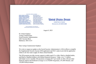 A partial. blurred screenshot of a letter in front of a red, abstract background.