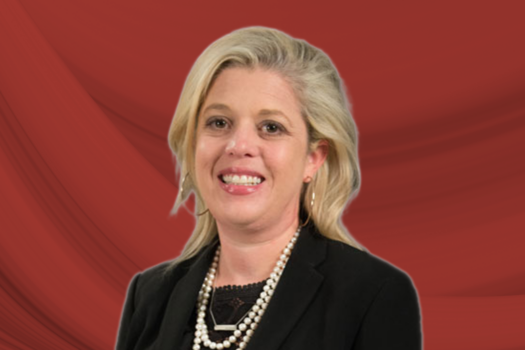 A headshot of Sarah Park against an abstract red background