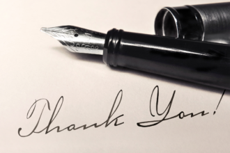 A black fountain pen and the words Thank You! written in cursive.